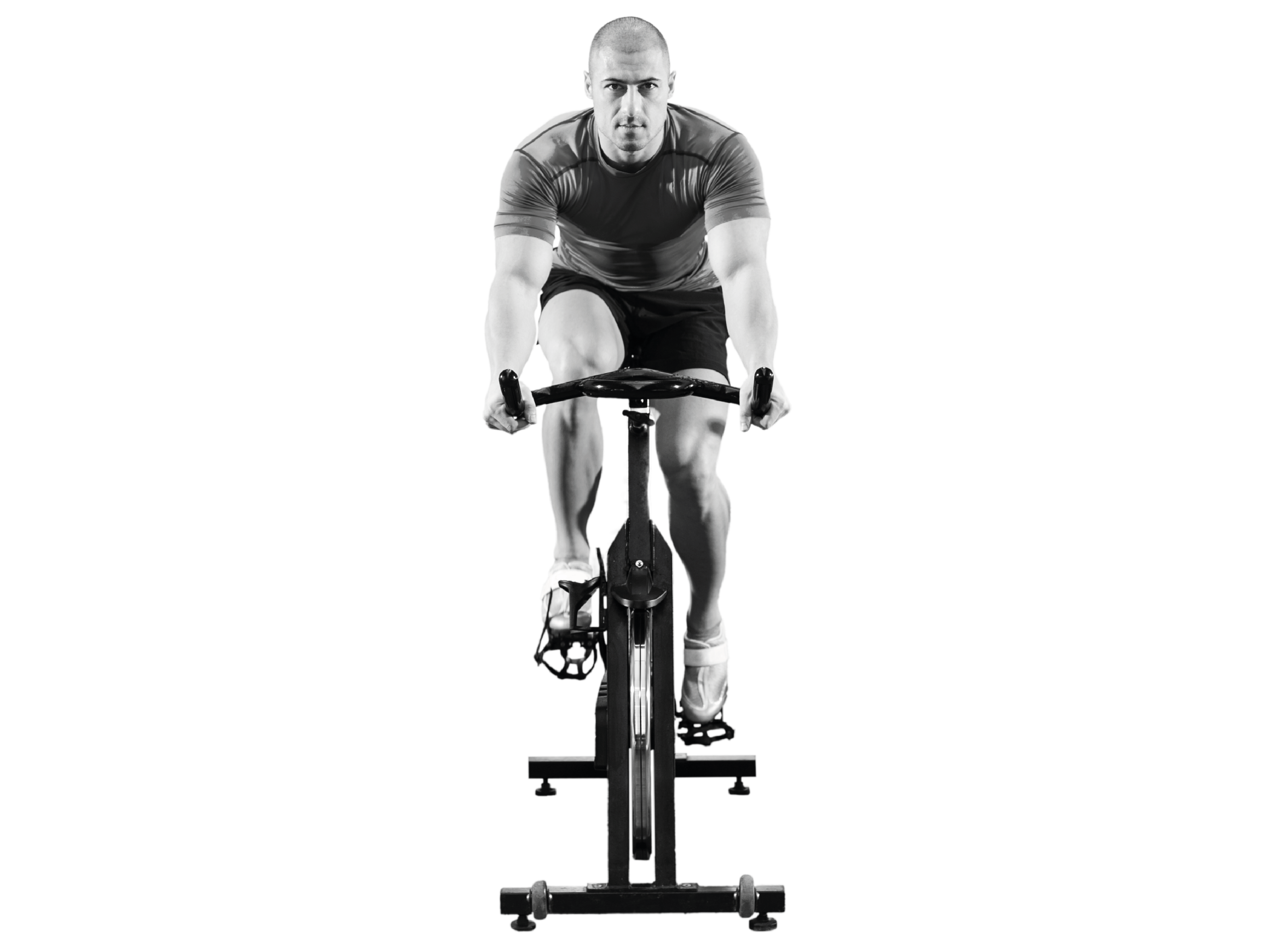 Hombre pedaleando en una bicicleta estática durante una sesión de cycling en el gimnasio Duplex de Andorra la Vella.