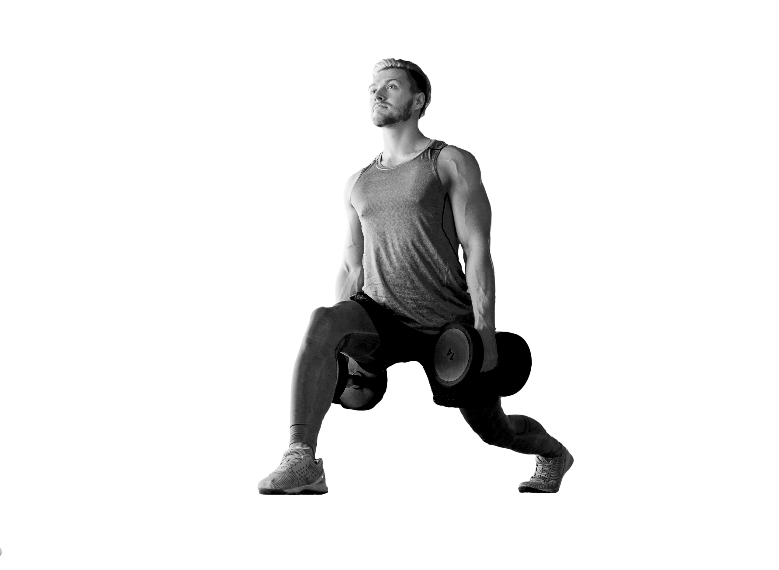 Hombre entrenando con barra y discos de peso durante una sesión de Duplex Body Train en el gimnasio Duplex de Andorra la Vella.