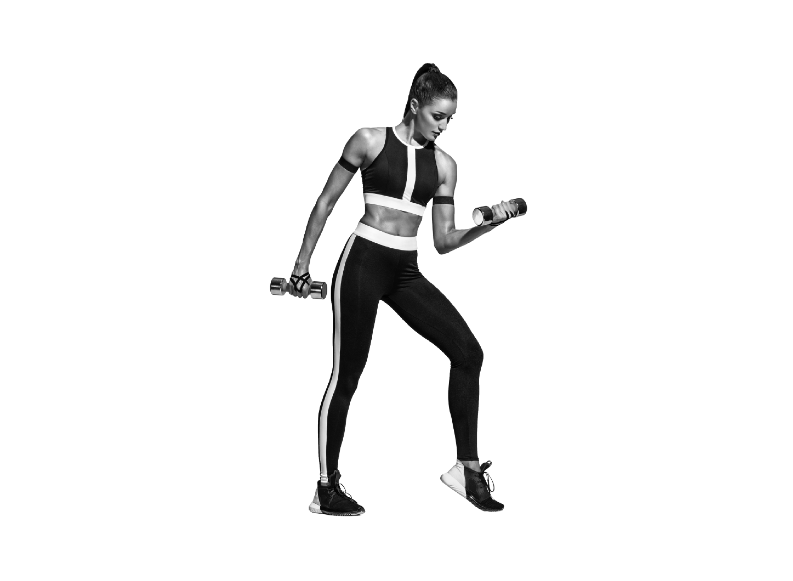 Mujer realizando un ejercicio de fuerza con mancuernas en una sesión de Gym Tonic en el gimnasio Duplex de Andorra la Vella.
